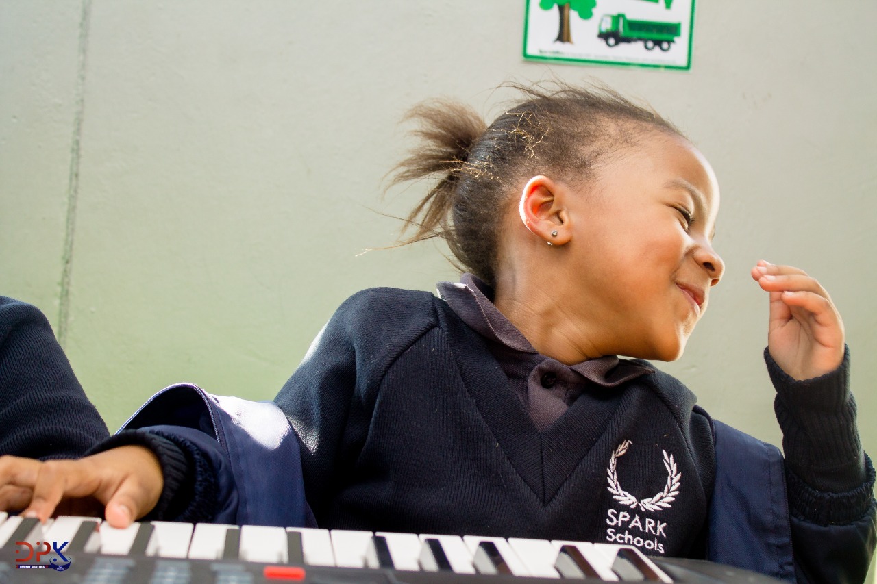 Piano lesson in progress at Spark School, Germiston